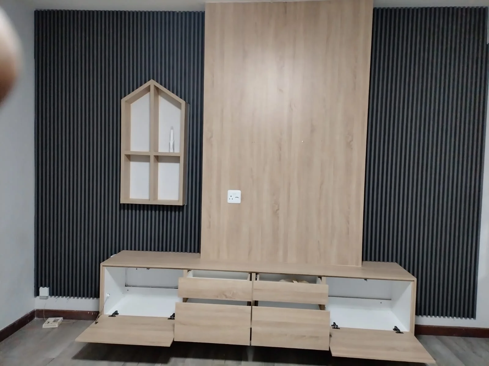 Media unit storage and drawer details by Z J Ceiling and Kitchen Masters