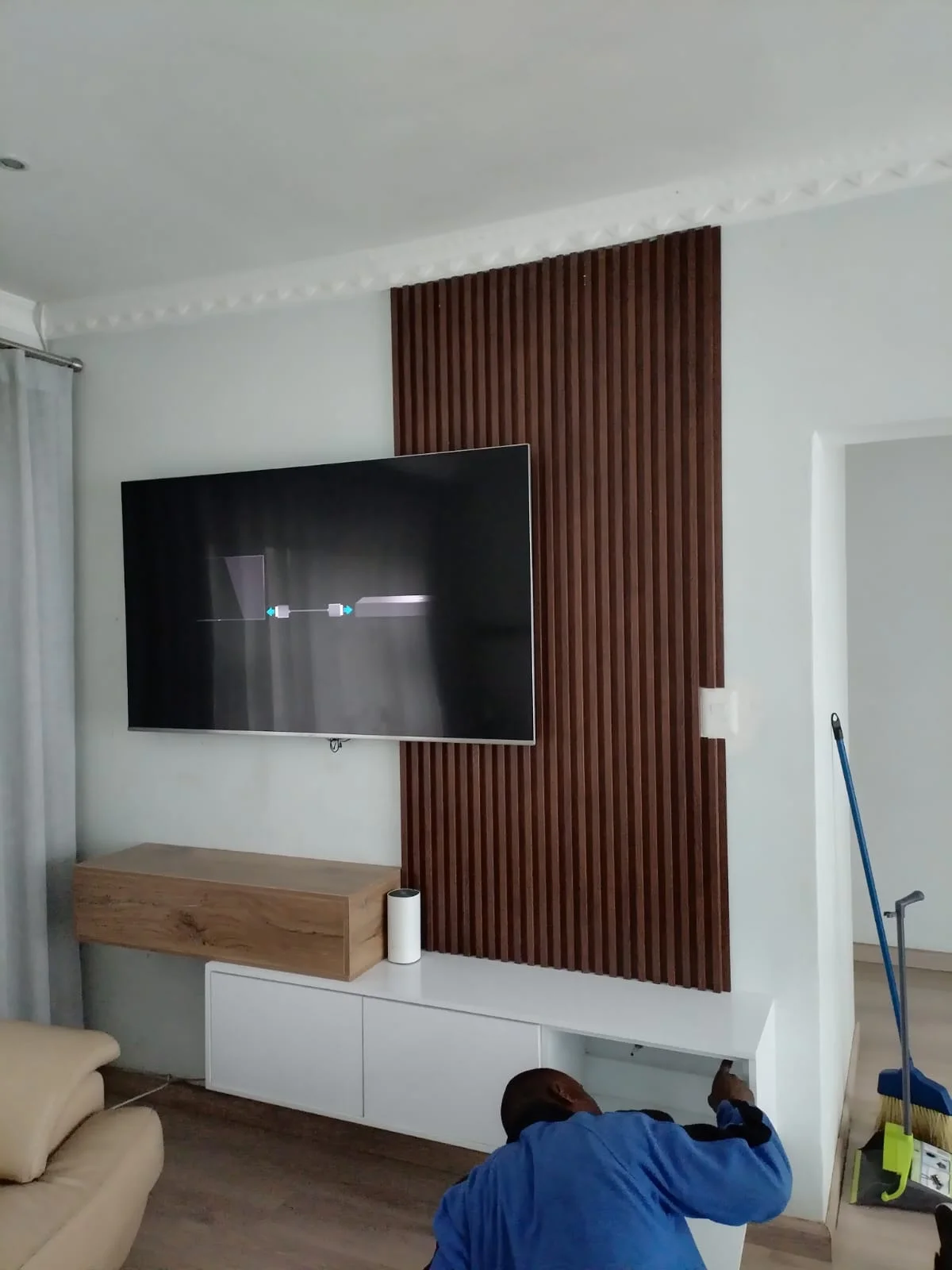 Floating media unit installation by Z J Ceiling and Kitchen Masters