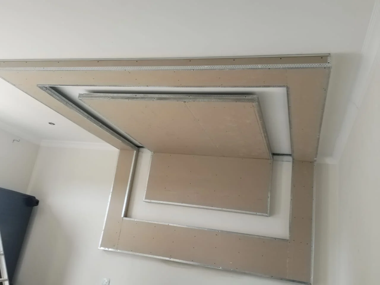 Ceiling bulkhead installation in progress by Z J Ceiling and Kitchen Masters