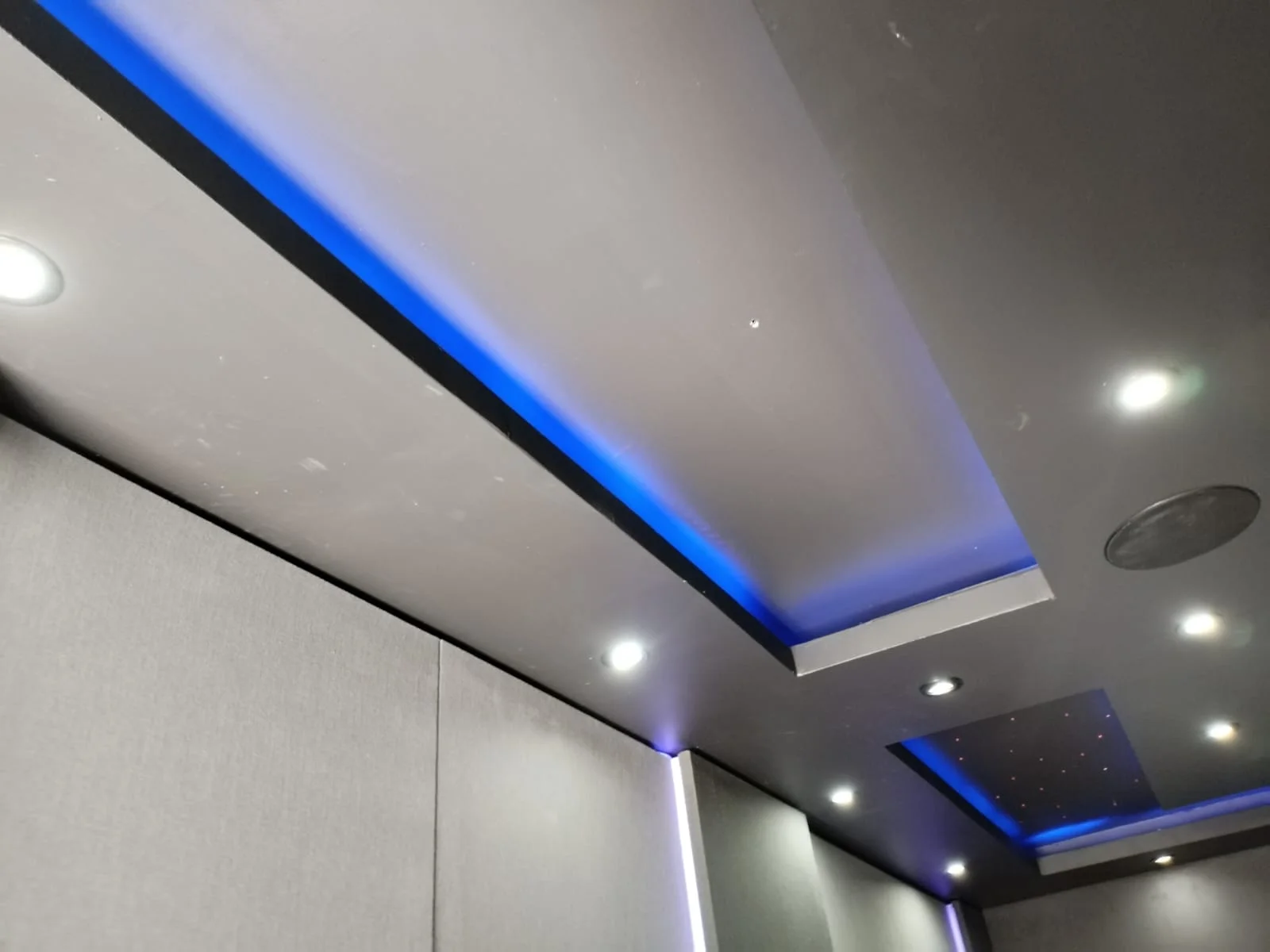 Recessed ceiling with blue accent lighting by Z J Ceiling and Kitchen Masters