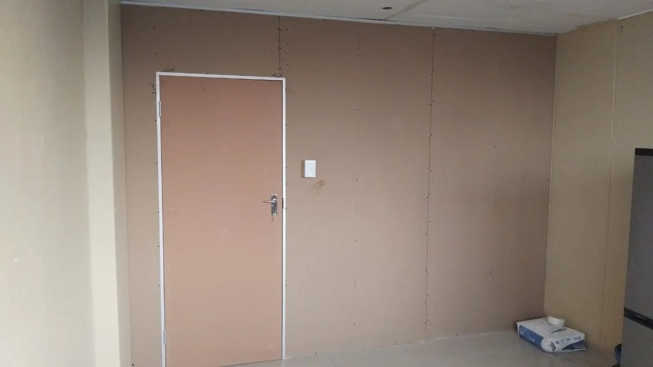 Drywall partition with fitted doorway by Z J Ceiling and Kitchen Masters
