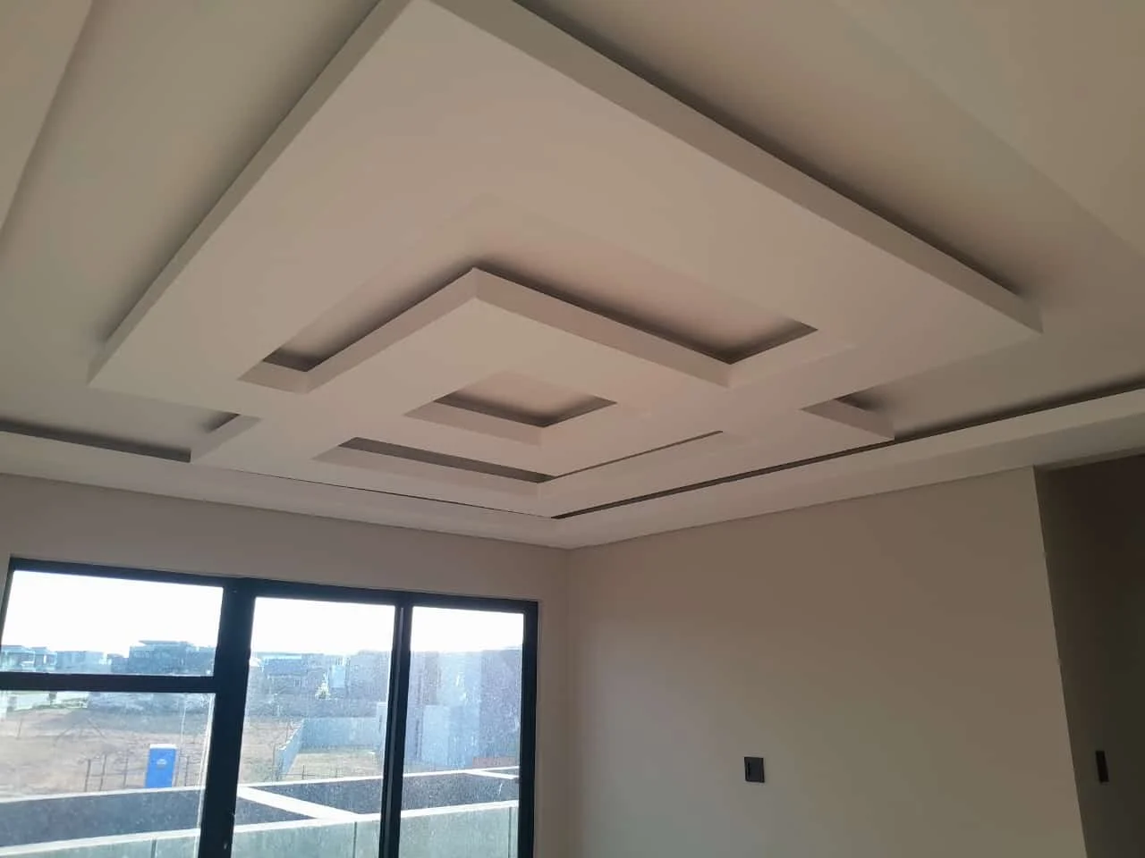 Geometric feature ceiling installed by Z J Ceiling and Kitchen Masters
